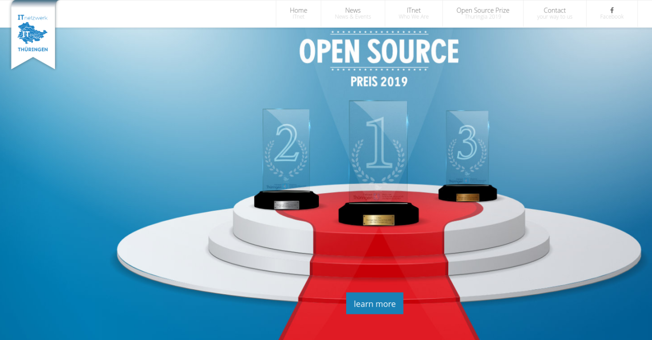 The image shows three award  image, marked with a 2 , 1  and  3, from left to right, on top of a red carpet