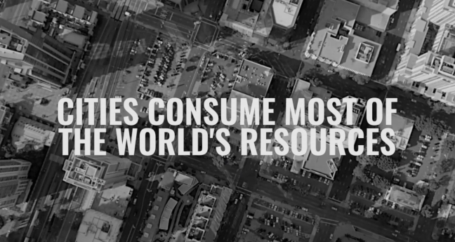 A screenshot from the fab city website. It shows a big city from above. Above the image is a slogan: cities consume most of the worlds resources.